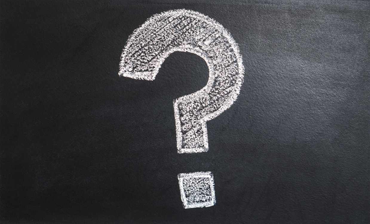 A question mark drawn on a chalkboard, representing an FAQ page rewrite