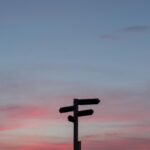 Silhouette of a road sign at golden hour, symbolizing a career pivot later in life