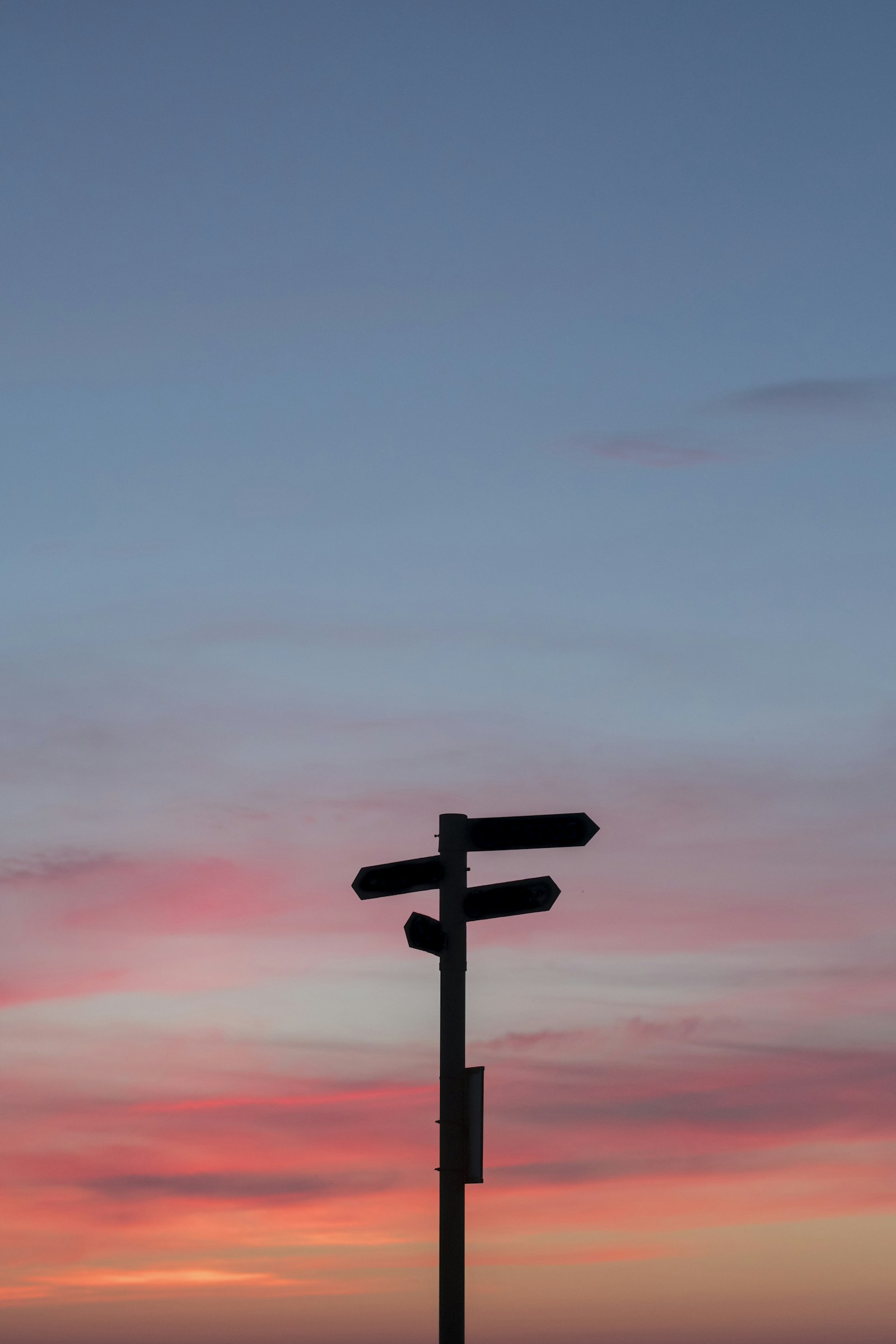 Silhouette of a road sign at golden hour, symbolizing a career pivot later in life