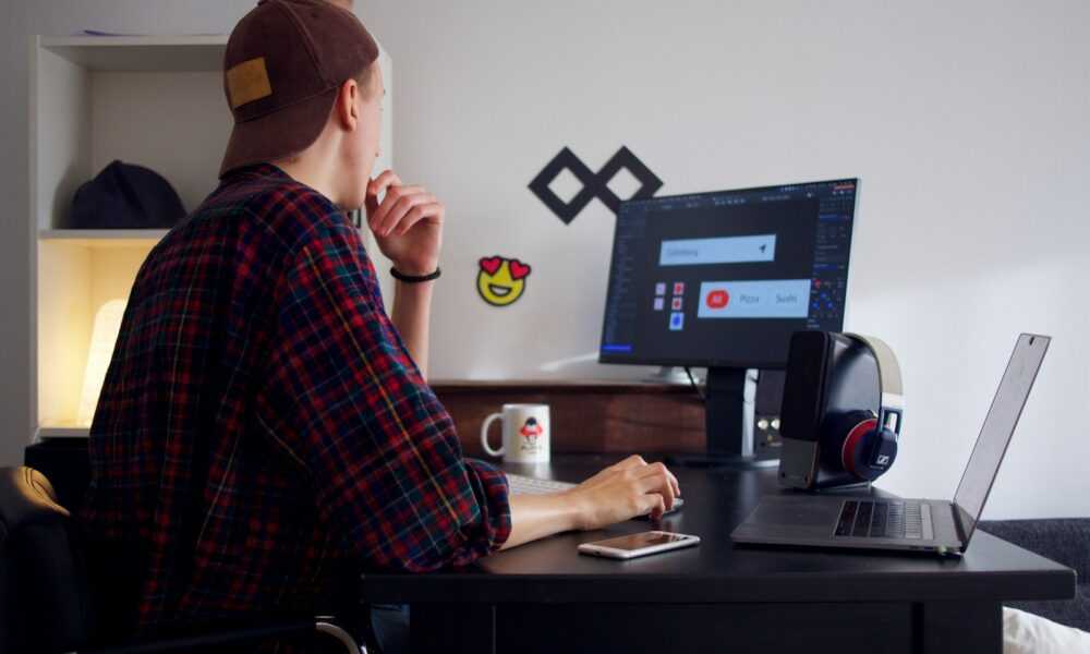 Person working independently at a laptop, representing the freelance-to-founder transition