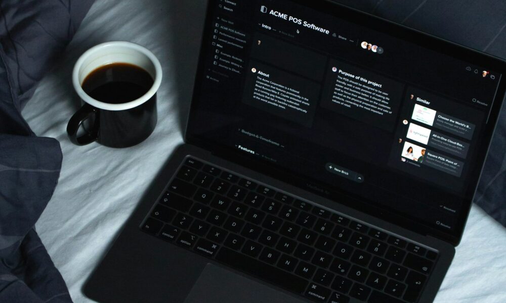 Laptop set up for independent work, representing the shift from employee to entrepreneur