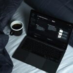 Laptop set up for independent work, representing the shift from employee to entrepreneur