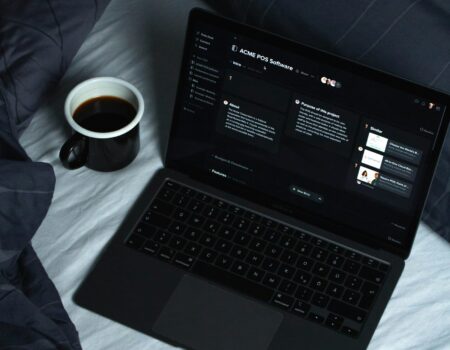 Laptop set up for independent work, representing the shift from employee to entrepreneur