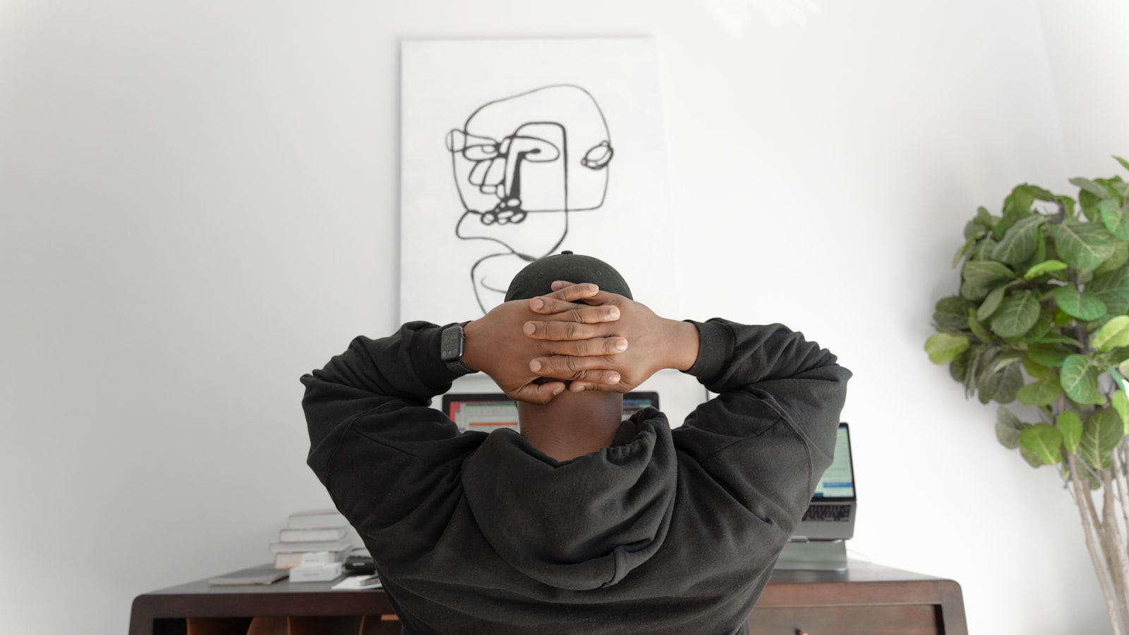 A person sitting thoughtfully, reflecting on career direction and passion versus practicality