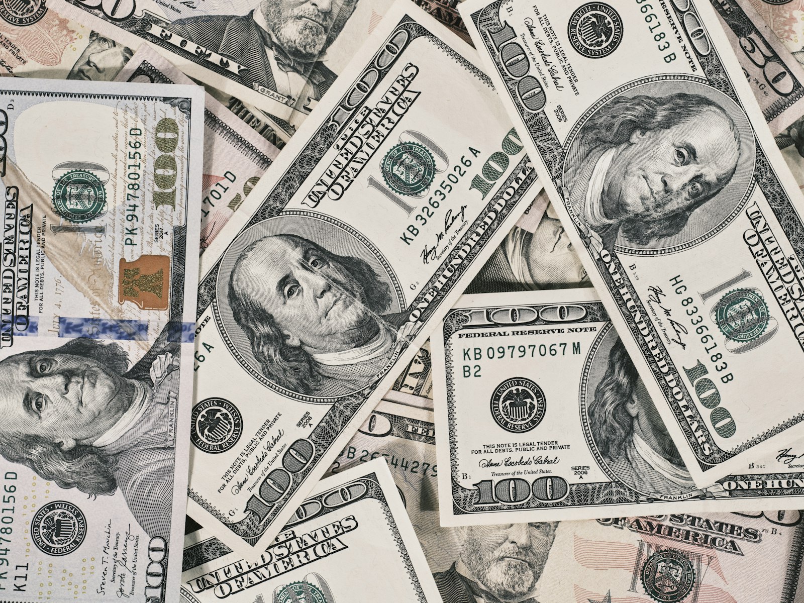 A pile of twenty dollar bills, representing how underpricing quietly becomes a cash flow problem