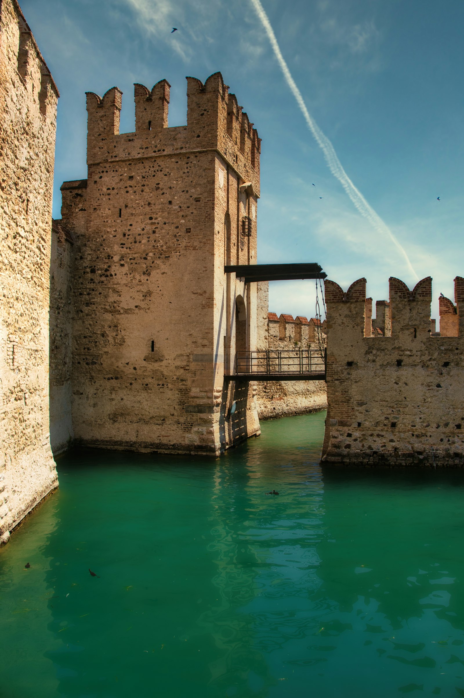 A medieval castle with a drawbridge over a moat, representing the real competitive moat small businesses can build